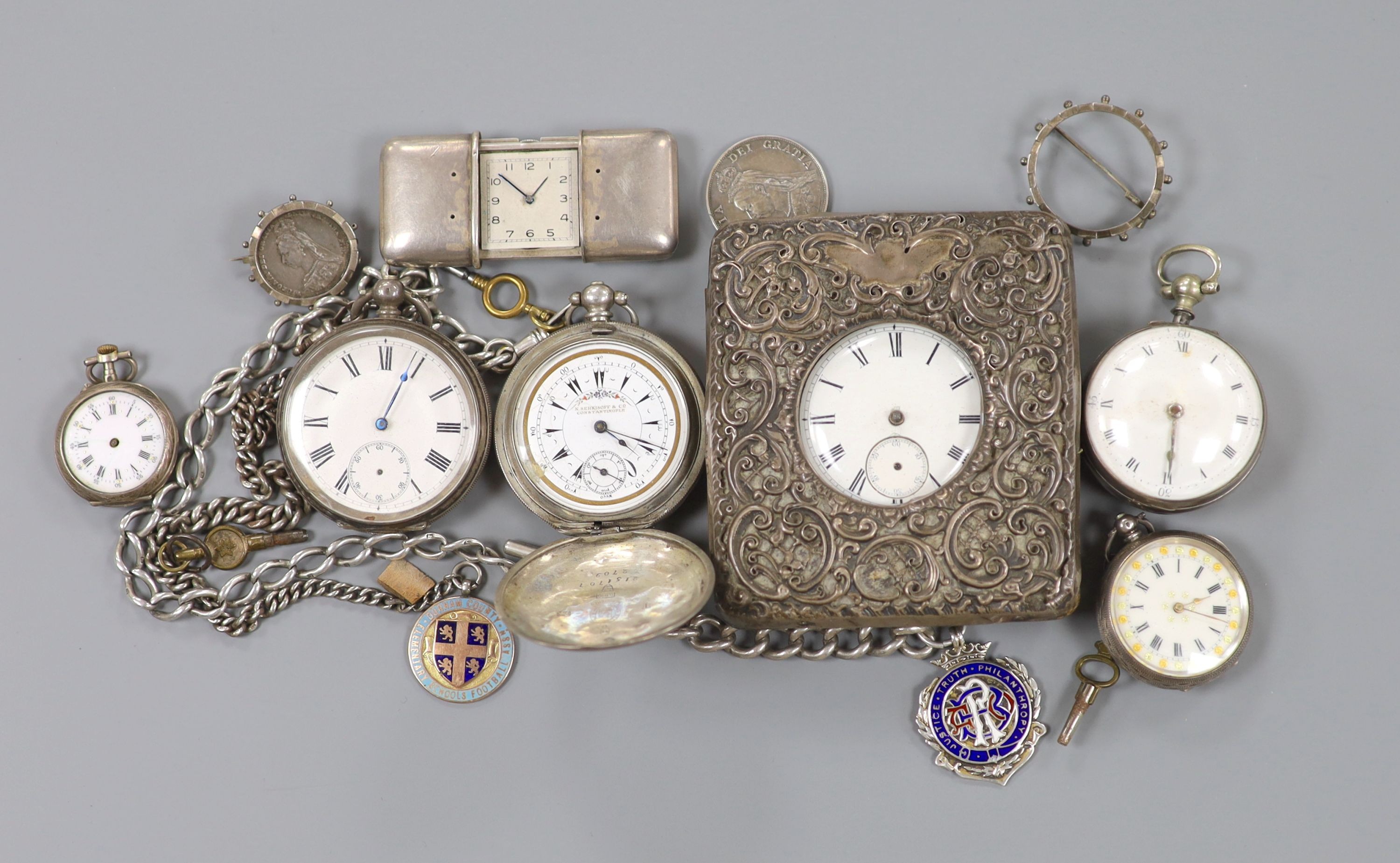 Part of a George III silver pair cased verge pocket watch, A Swiss silver cased travelling watch, five other pocket watches including one in silver mounted travelling case and one with silver albert and two mounted coins